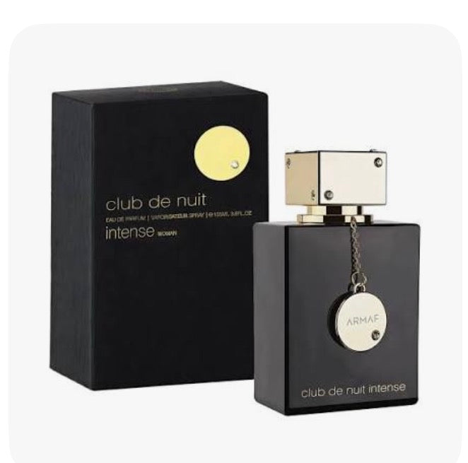 Perfume bottle and box set with dark glass, gold accent label, spray